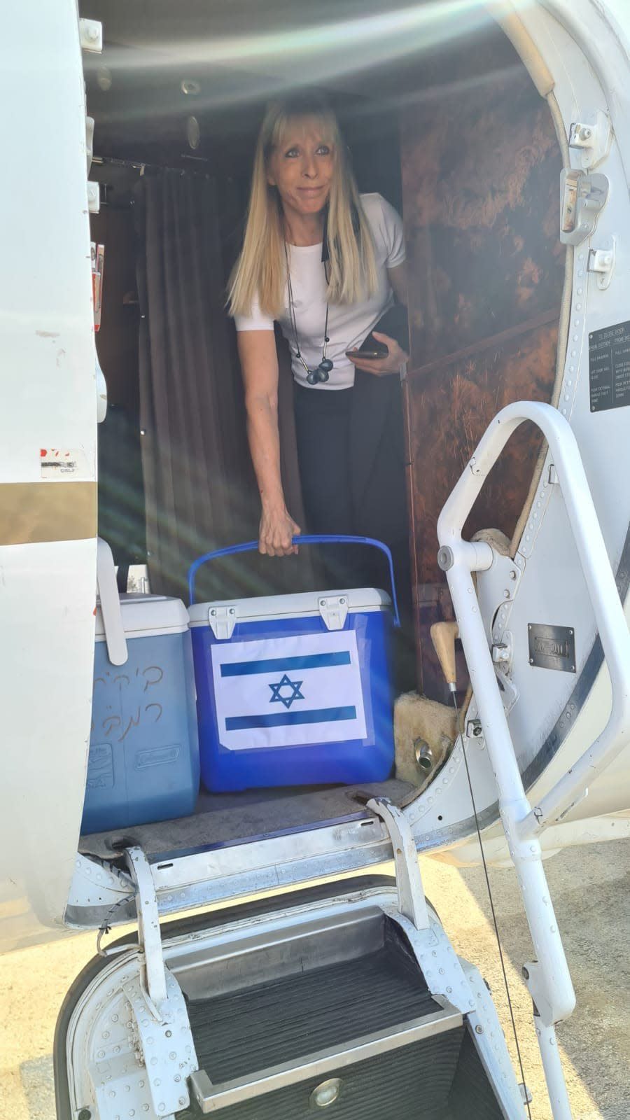 Tamar Ashkenazi, managing director of the Israel National Transplant Center, steps off the private jet used to shuttle a kidney from a living Jewish donor to an ailing Arab mother she did not know. The exchange between nations with typically chilly relations was historic, seeing three sets of donors helping three unknown recipients, regardless of nationality or religion.