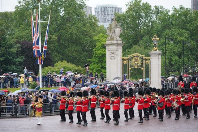 The Band of the Grenadier Guards march along The Mall towards Horse Guards Parade 