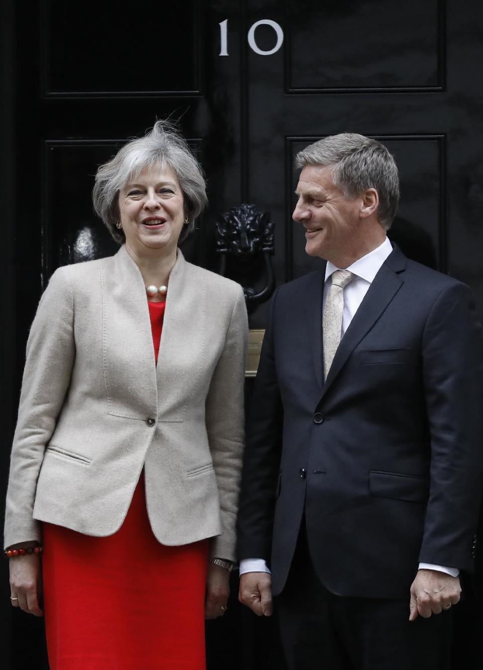 Britain's Prime Minister Theresa May greets the Prime Minister of New Zealand Bill English on the doorstep of 10 Downing Street ahead of their meeting in London, Friday, Jan. 13, 2017. (AP Photo/Frank Augstein)