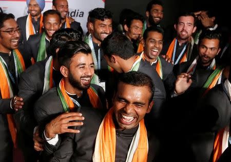 Indian men hockey team captain Sreejesh Parattu Raveendran (C-foreground) shares a moment with his team members, who will participate in the Rio 2016 Olympics, during an introduction ceremony of the team, in New Delhi, India, July 12, 2016. REUTERS/Adnan Abidi/Files