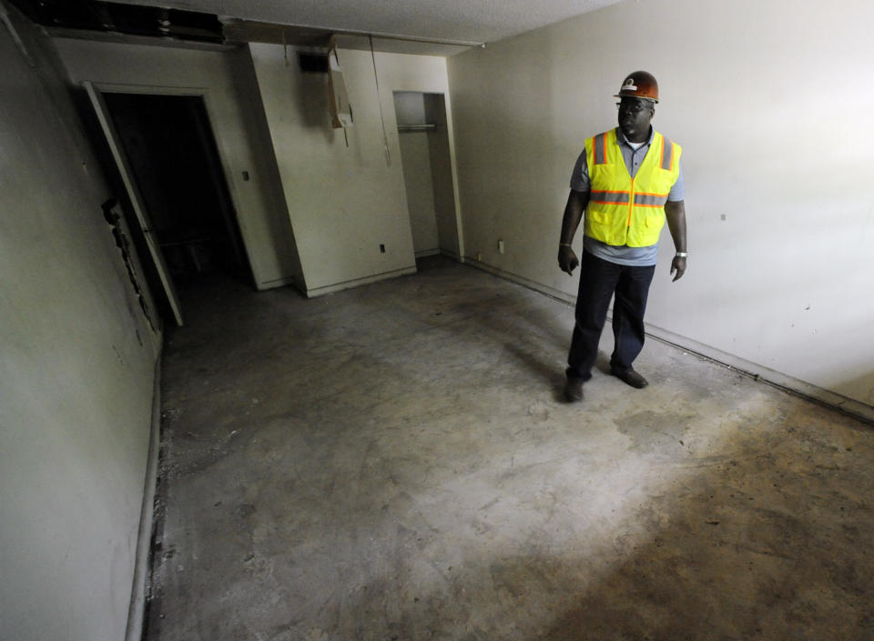 Renovation worker Rogers Hunt stands in a room once occupied by Martin Luther King Jr. in the old A.G. Gaston Motel in Birmingham, Ala., on Wednesday, April 17, 2019. Once featured in the "The Negro Motorist Green Book," the long-closed motel provided a home for King during civil rights demonstrations in the 1960s. It is is being transformed into the centerpiece of a new national civil rights monument. (AP Photo/Jay Reeves)