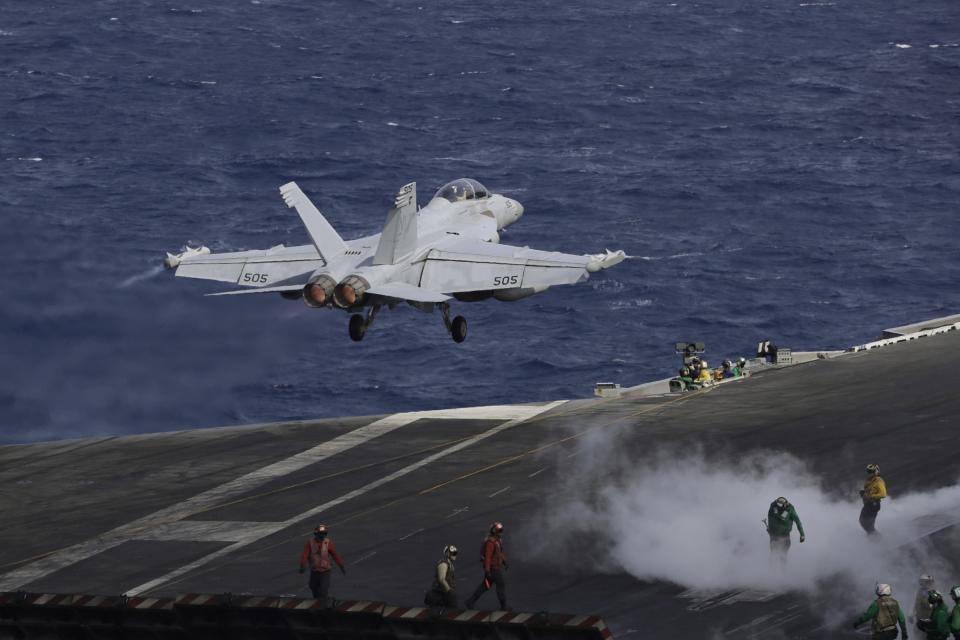 An F/A-18 Super Hornet fighter jet takes off on the deck of the U.S. Navy USS Ronald Reagan in the South China Sea, Tuesday, Nov. 20, 2018.