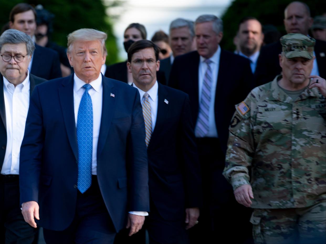 Donald Trump walks with Chairman of the Joint Chiefs of Staff Mark Milley and others to visit St John’s Church on June 1, 2020, in Washington, DC. (AFP via Getty Images)