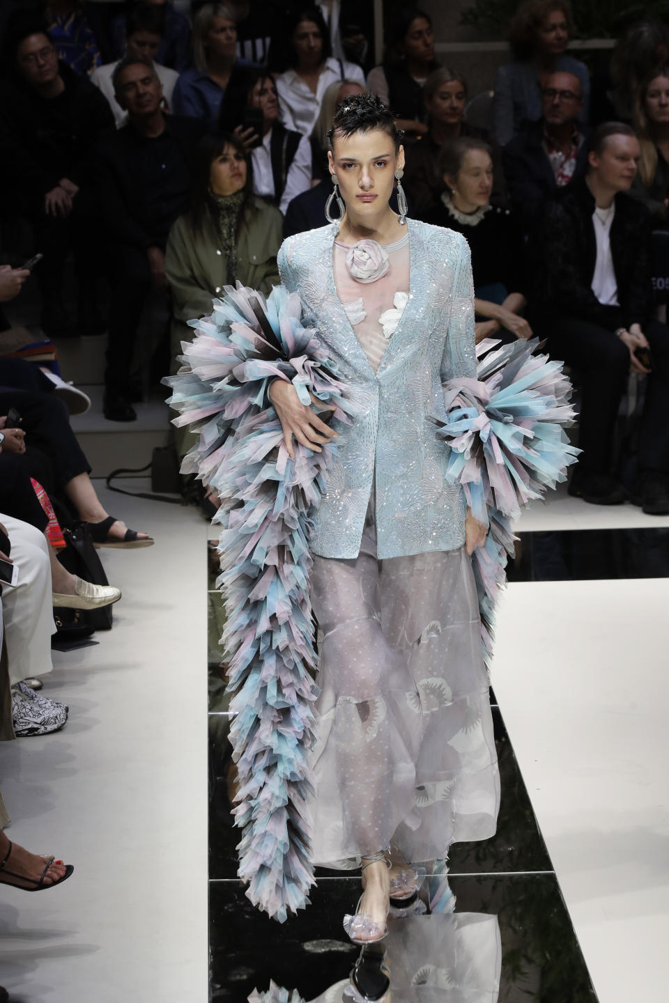 A model wears a creation as part of the Armani Spring-Summer 2020 collection, unveiled during the fashion week, in Milan, Italy, Saturday, Sept. 21, 2019. (AP Photo/Luca Bruno)