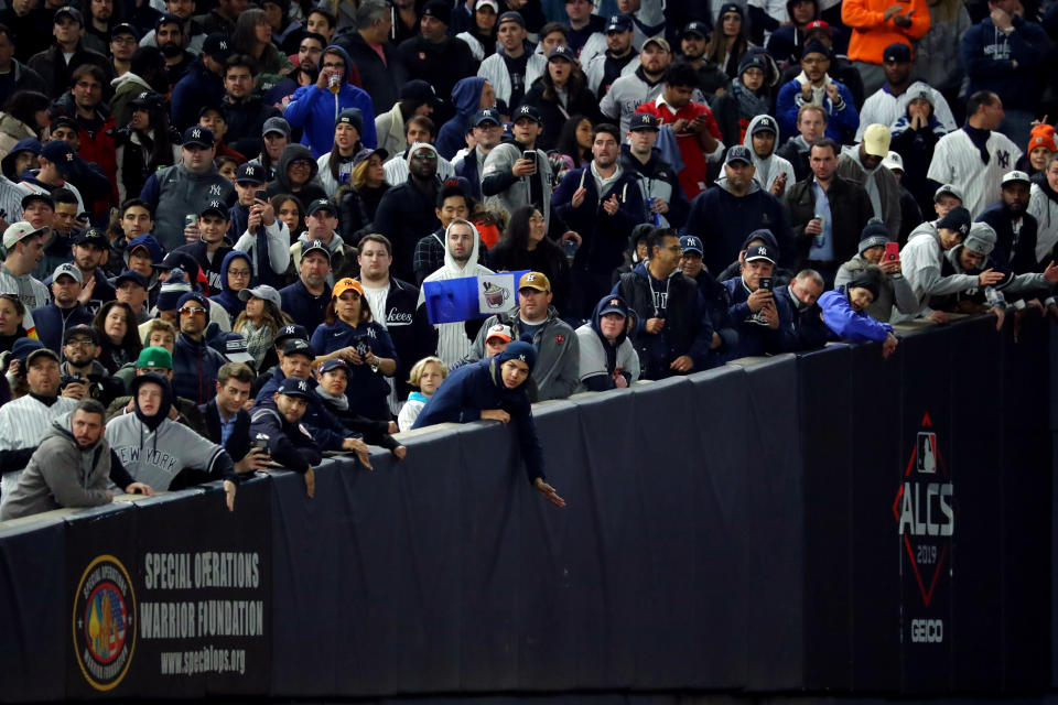 BRONX, NY - OCTOBER 18:  Fans are seen cheering during Game 5 of the ALCS between the Houston Astros and the New York Yankees at Yankee Stadium on Friday, October 18, 2019 in the Bronx borough of New York City. (Photo by Alex Trautwig/MLB Photos via Getty Images)