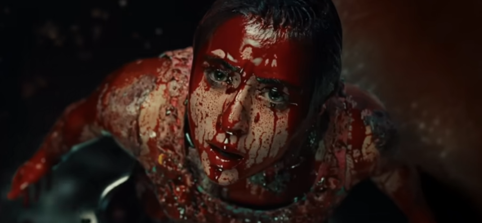closeup of a woman with blood covering her