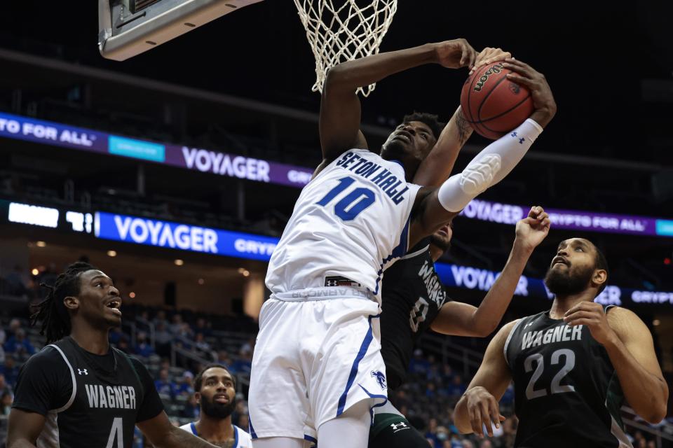 Seton Hall Pirates forward Alexis Yetna (10) rebounds against Wagner Seahawks forward Nigel Jackson (0) and forward Ja'Mier Fletcher (22)