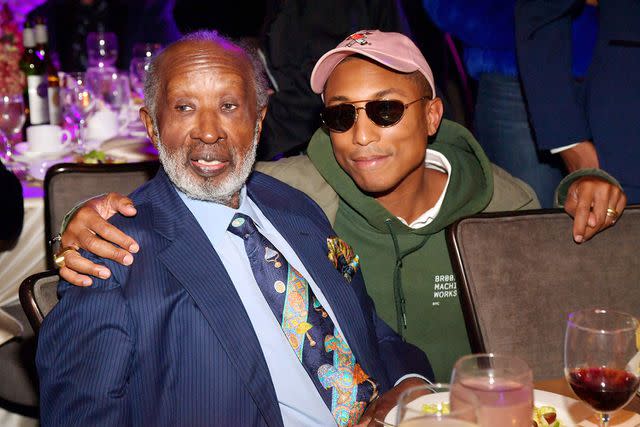 <p>Lester Cohen/Getty</p> Clarence Avant and Pharrell Williams