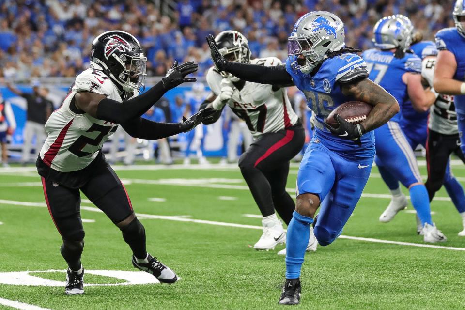 Detroit Lions running back Jahmyr Gibbs (26) runs against Atlanta Falcons safety Richie Grant (27) during the second half at Ford Field in Detroit on Sunday, Sept. 24, 2023.