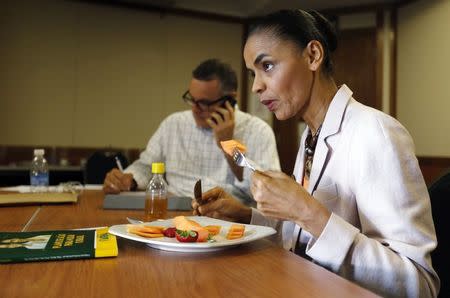 Presidential candidate Marina Silva of the Brazilian Socialist Party (PSB) eats fruits before an interview with Reuters in Rio de Janeiro September 25, 2014. REUTERS/Sergio Moraes