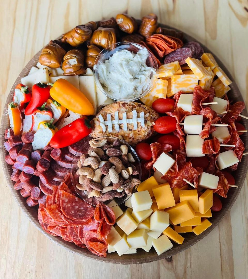 Yellow Finch Creations works to suit every taste. This is a tray she made for Scott Ebert for a football party. He requested a “manly” tray and was very happy with his meats, cheese, nuts, pretzels and more.