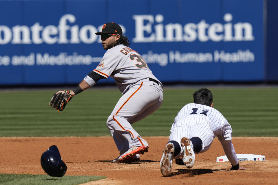 New York Yankees' Anthony Volpe, right, steals second base behind San Francisco Giants shortstop Brandon Crawford during the third inning of an opening day baseball game at Yankee Stadium Thursday, March 30, 2023, in New York. (AP Photo/Seth Wenig)