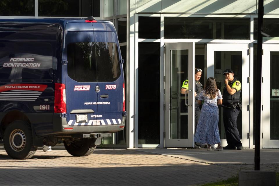 Members of the Waterloo Regional Police investigate a stabbing at the University of Waterloo, in Waterloo, Ont., Wednesday, June 28, 2023. Waterloo Regional Police said three victims were stabbed inside the universityÕs Hagey Hall, with one person was taken into custody. THE CANADIAN PRESS/Nick Iwanyshyn