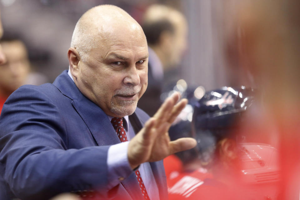 Oct 18, 2014; Washington, DC, USA; Washington Capitals head coach Barry Trotz talks to his team from behind the bench against the Florida Panthers in the first period at Verizon Center. The Capitals won 2-1 in a shootout. (Geoff Burke-USA TODAY Sports)