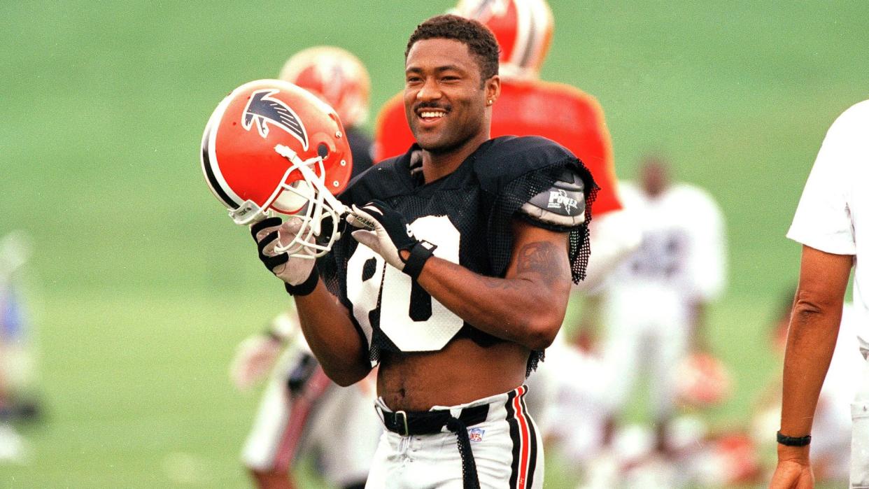 Mandatory Credit: Photo by John Bazemore/AP/Shutterstock (6513692a)Andre Rison Atlanta Falcons' receiver Andre Rison jokes with a teammate as he prepares for a drill during the team's first full workout at their training complex in Suwanee, Ga.