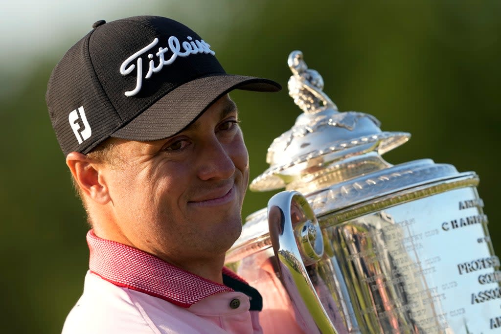 Justin Thomas poses with the Wanamaker Trophy after winning the US PGA Championship for the second time (Matt York/AP) (AP)