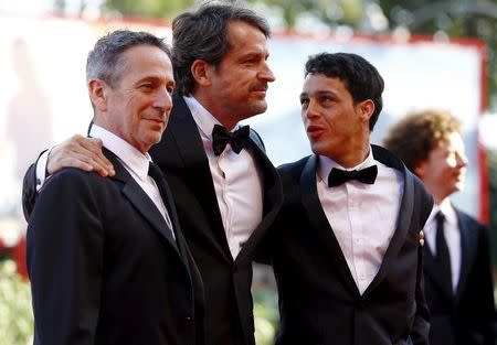 Director Lorenzo Vigas (C), actors Alfredo Castro (L) and Luis Silva attend the red carpet event for the movie "Desde Alla" (From Afar) at the 72nd Venice Film Festival, northern Italy September 10, 2015. REUTERS/Stefano Rellandini