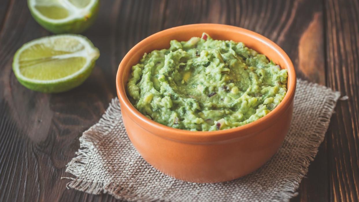 bowl of guacamole on the wooden table,romania