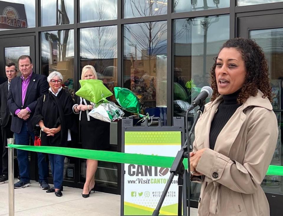 Tonja Marshall of Visit Canton address attendees of Friday's opening of a new welcome center at the Hall of Fame Village.