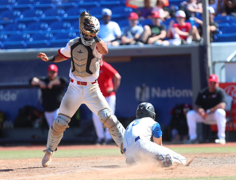 Somers' Evan Carway (26) attempts a tag at home on Maine-Endwell's Niko Anastos (18) in the Class A regional final baseball game at Dutchess Stadium in Wappingers Falls, on Saturday, June 4, 2022.