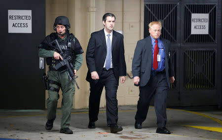 Former North Charleston police officer Michael Slager is escorted from the courthouse by security personnel while waiting on his verdict at the Charleston County Courthouse in Charleston, South Carolina, U.S., December 5, 2016. REUTERS/Randall Hill