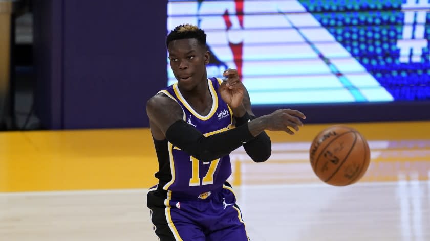 Los Angeles Lakers guard Dennis Schroder (17) passes the ball during the first quarter of an NBA basketball game against the New Orleans Pelicans Friday, Jan. 15, 2021, in Los Angeles. (AP Photo/Ashley Landis)