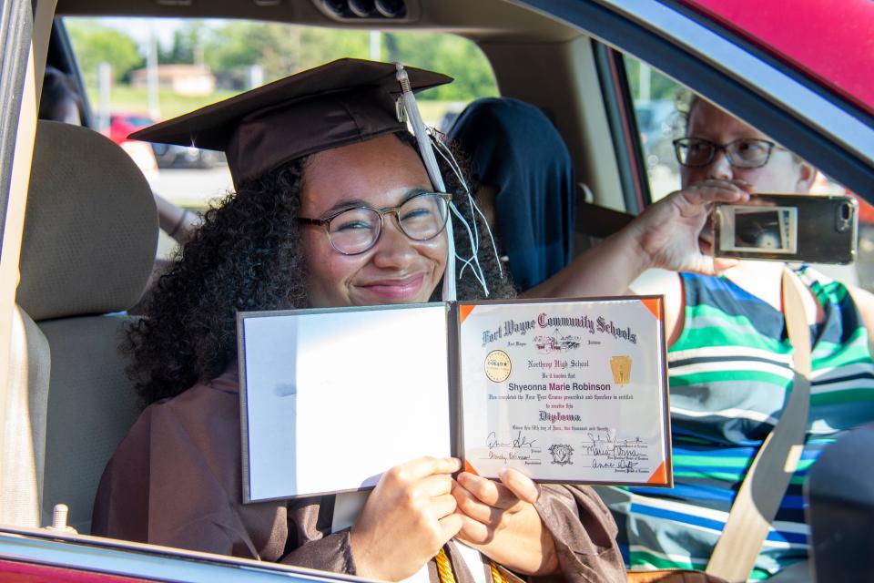 Shye Robinson graduated in 2020, salutatorian of her class at Northrop High in Fort Wayne. In the driver's seat is Robinson's foster mom, Shannon Roberts.