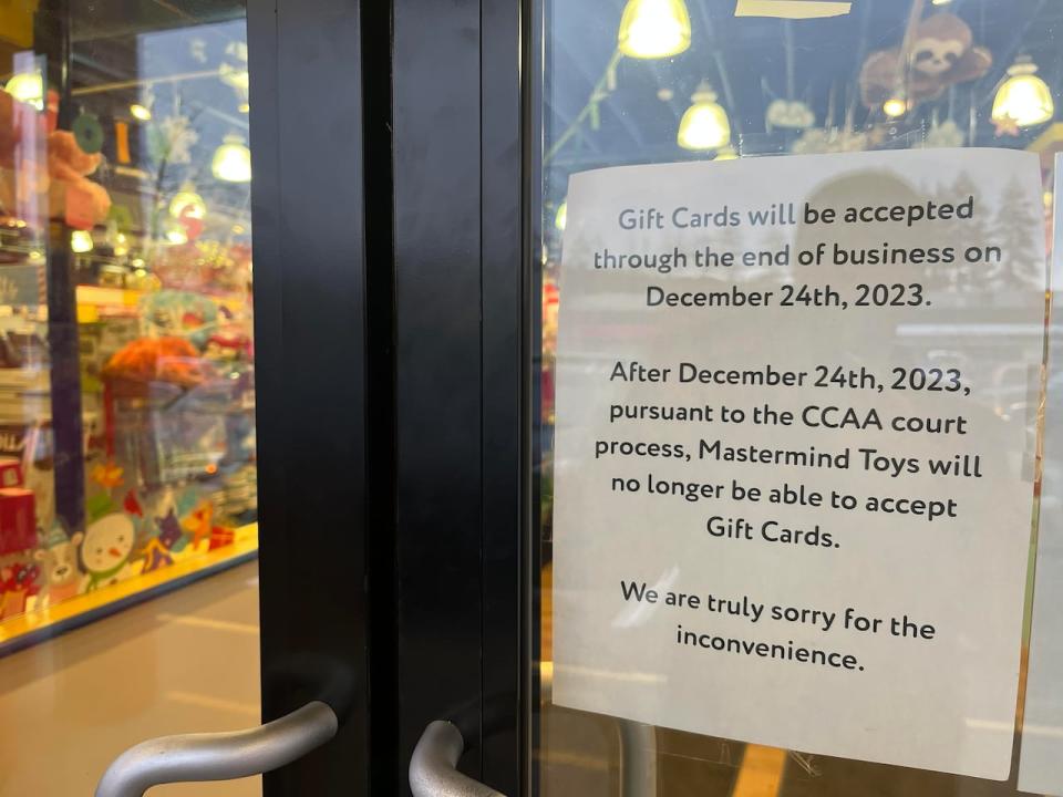 A sign is posted on the door of a Mastermind Toys in Coquitlam, B.C. on Dec. 20, 2023 notifying customers that the company will not be able to accept gift cards after Christmas Eve.