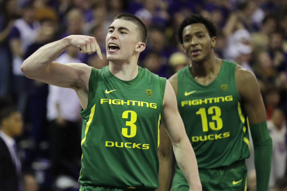 Oregon guard Payton Pritchard (3), reacts with forward Chandler Lawson (13) after Pritchard made the game-winning 3-point basket in overtime of an NCAA college basketball game against Washington, Saturday, Jan. 18, 2020, in Seattle. Oregon won 64-61 in overtime. (AP Photo/Ted S. Warren)