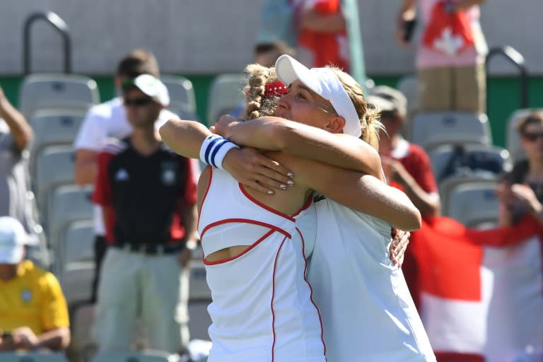 Ekaterina Makarova (left) and Elena Vesnina celebrate after winning the women's doubles final in Rio on August 14, 2016