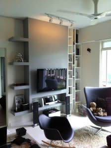 Accent wall in living room, with storage ledges on the side