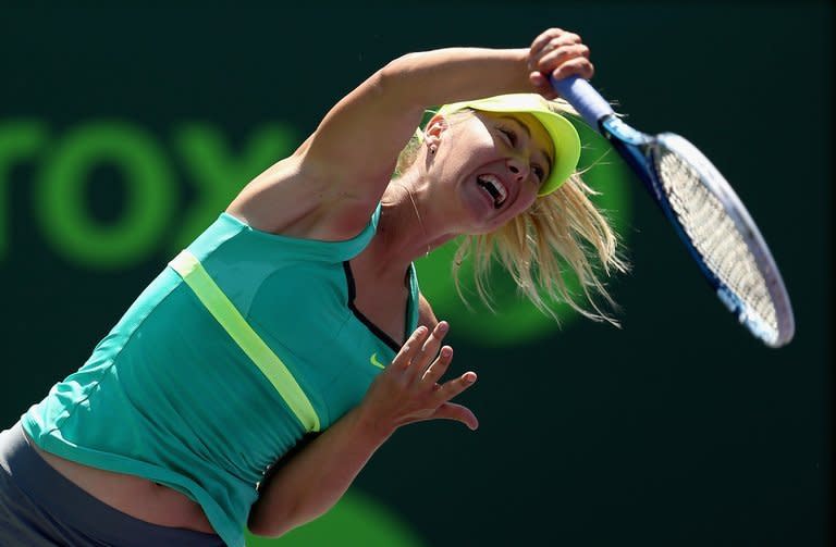 Maria Sharapova of Russia serves against Jelena Jankovic of Serbia during their semi-final match at the Sony Open at Crandon Park Tennis Center in Key Biscayne, Florida, on March 28, 2013. Sharapova won 6-2, 6-1