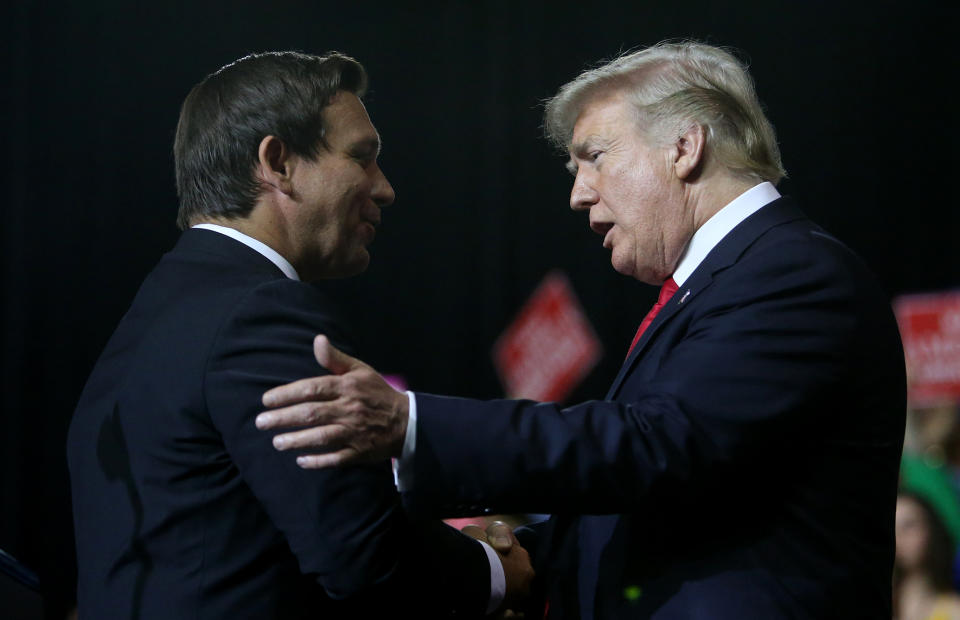 President Trump greets Ron DeSantis during a rally at the Florida State Fairgrounds in Tampa on Tuesday. (Photo: ©James Borchuck/Tampa Bay Times via ZUMA Wire)