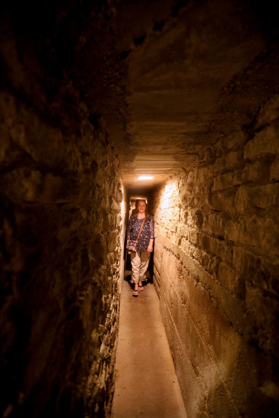 Sis Schmidt tours the tunnel that was part of the Underground Railroad used by slaves seeking freedom at the Milton House Museum. The original tunnel averaged 3½ feet in height. The height was raised to its current 6 feet in the 1950s to allow tourists to experience the space.
