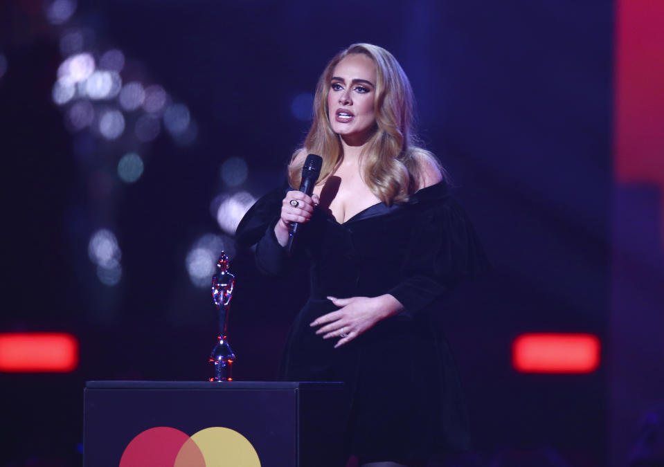 Adele on stage to accept her award for Artist of the Year at the Brit Awards 2022 in London Tuesday, Feb. 8, 2022. (Photo by Joel C Ryan/Invision/AP)