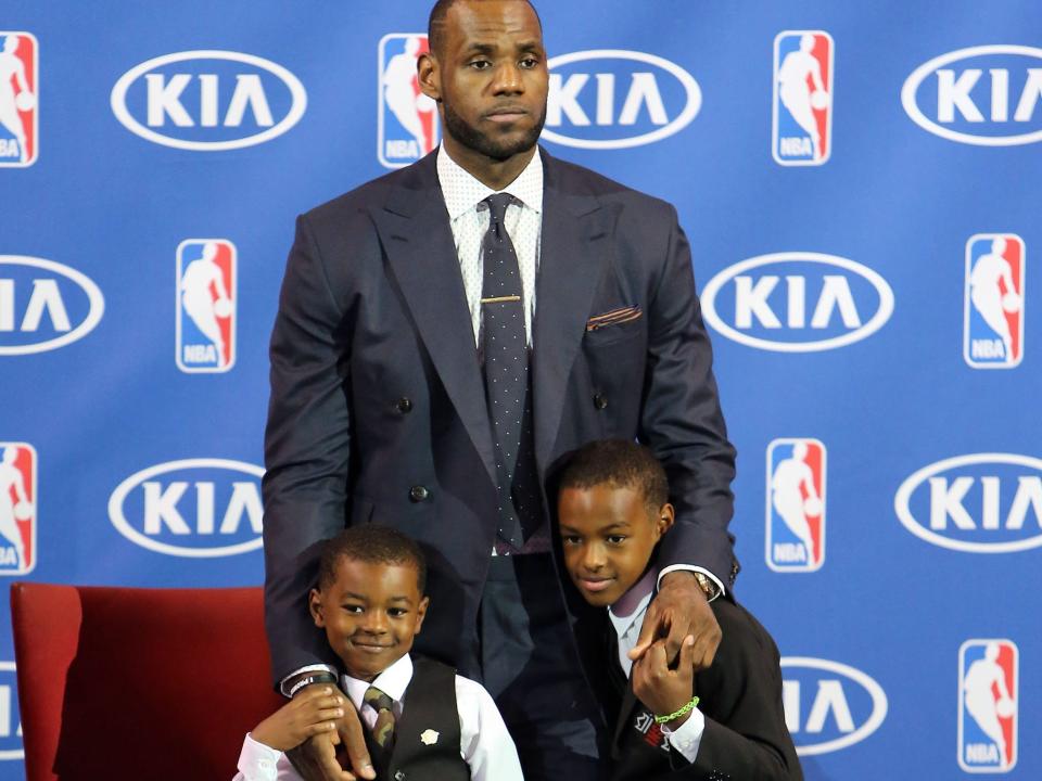 Bryce James, LeBron James and LeBron James Jr attend the LeBron James press confernece to announce his 4th NBA MVP Award at American Airlines Arena on May 5, 2013 in Miami, Florida.