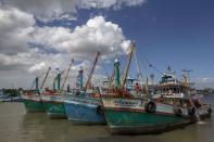A view of docked fishing vessels after fishing operations stopped at a port in Samut Songkharm province, Thailand, July 1, 2015. REUTERS/Athit Perawongmetha