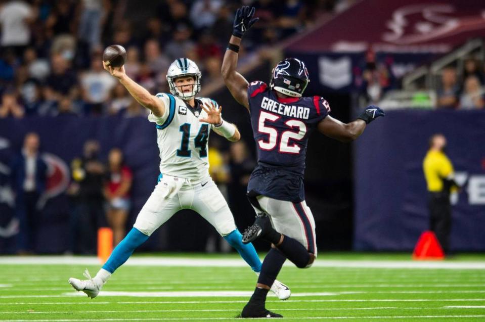 Panthers quarterback Sam Darnold throws a pass as Texans defensive lineman Jonathan Greenard tries to block during the game at NRG Stadium on Thursday, September 21, 2021 in Houston, TX. The Panthers beat the Texans 24-9, giving them their third win in a row to start the season.