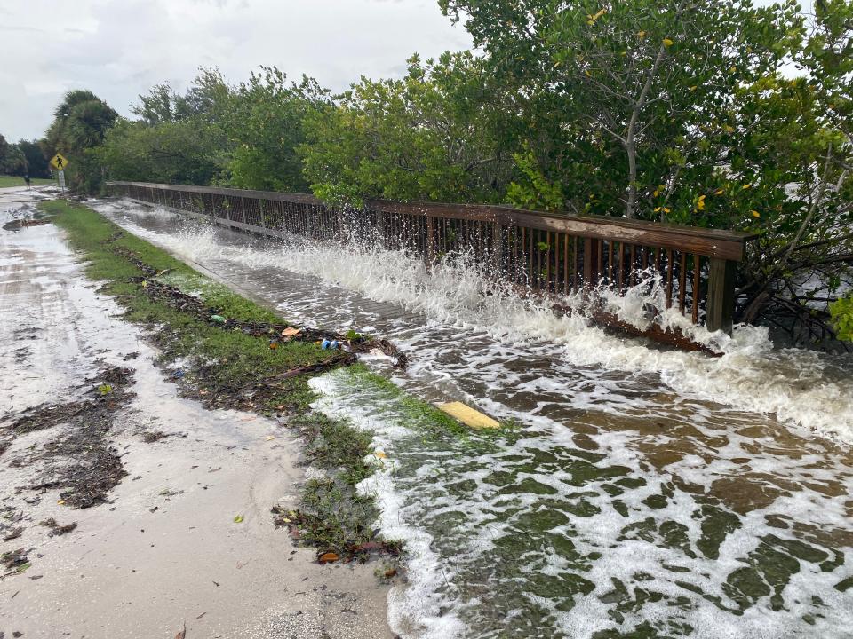 Hurricane Ian pushes waves from the Indian River Lagoon through the wooden boardwalk at Kiwanis Park at Geiger Point off the Melbourne Causeway on Sept. 28. The boardwalk remains damaged from the storm.