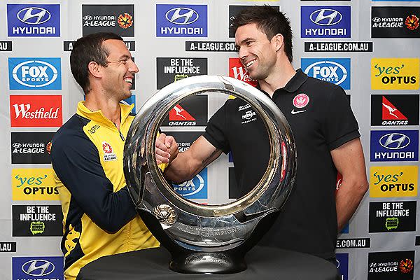 Mariners captain, John Hutchinson and Wanderers captain, Michael Beauchamp shake hands in front of the Hyundai A-League Champions Trophy.