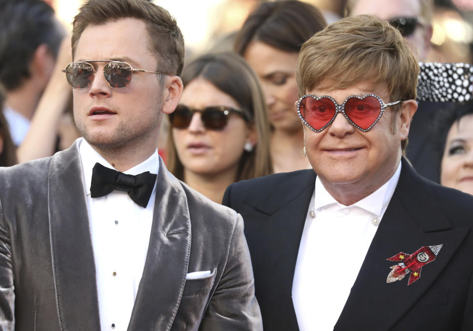 Actor Taron Egerton, left, and singer Elton John pose for photographers upon arrival at the premiere of the film 'Rocketman' at the 72nd international film festival, Cannes, southern France, Thursday, May 16, 2019. (Photo by Vianney Le Caer/Invision/AP)