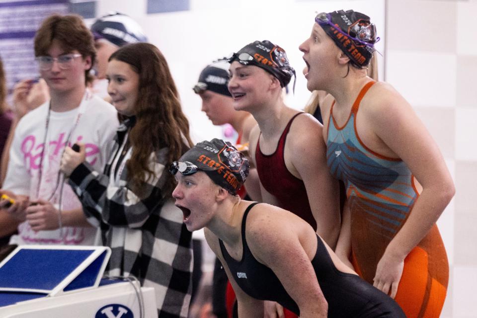 Students of Emery High School cheer for their teammates during the women’s 200 yard medley relay at swimming preliminaries for state championships at BYU’s Richards Building in Provo on Friday, Feb. 16, 2024. | Marielle Scott, Deseret News