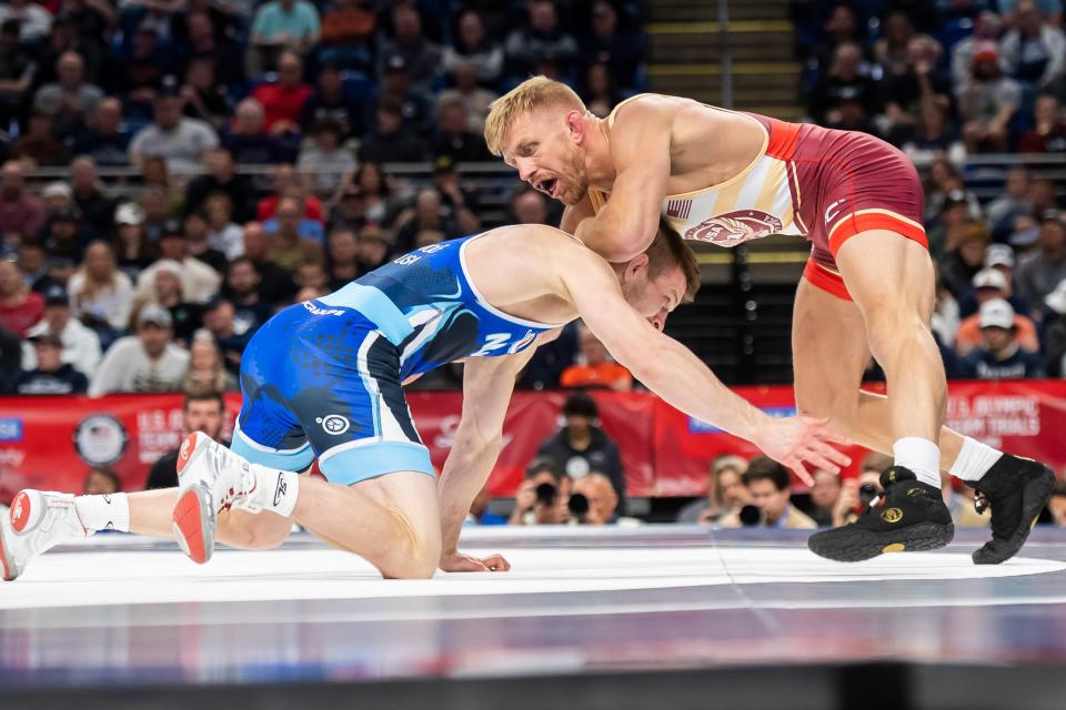 Kyle Dake (right) avoids a shot from Jason Nolf in the 74-kilogram best-of-three championship series during the U.S. Olympic Team Trials at the Bryce Jordan Center April 20, 2024, in State College, Pennsylvania. Dake won the first bout, 4-1, and the second 3-1 to earn an Olympics berth.