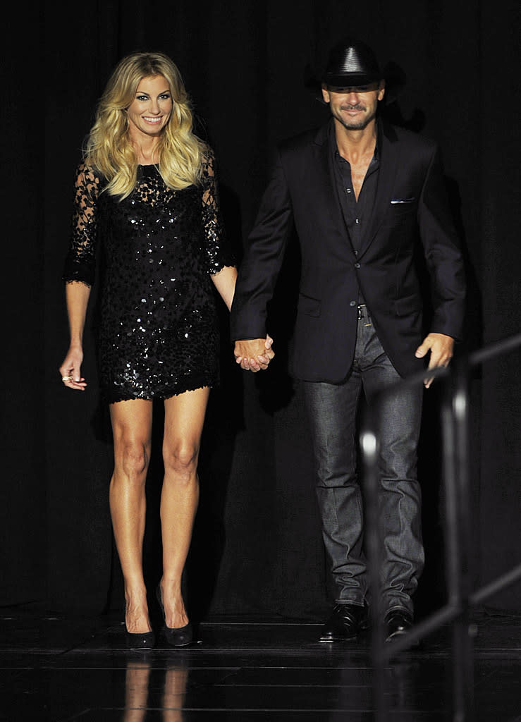 Speaking of sexy singers, check out Nashville's most dynamic duo, Faith Hill and Tim McGraw, who also made a big announcement this week. On Tuesday morning, the husband and wife unveiled their <a href="http://omg.yahoo.com/news/tim-mcgraw-faith-hill-announce-las-vegas-shows-180318595.html" data-ylk="slk:"Soul2Soul" concert residency;elm:context_link;itc:0;sec:content-canvas;outcm:mb_qualified_link;_E:mb_qualified_link;ct:story;" class="link  yahoo-link">"Soul2Soul" concert residency</a> during a press conference at Sin City's Venetian luxury hotel and casino resort. Dressed in a sequined frock, Faith looked fab next to her country-crooning hubby, who opted for a blazer and button-down, along with his signature cowboy hat. (8/7/2012)