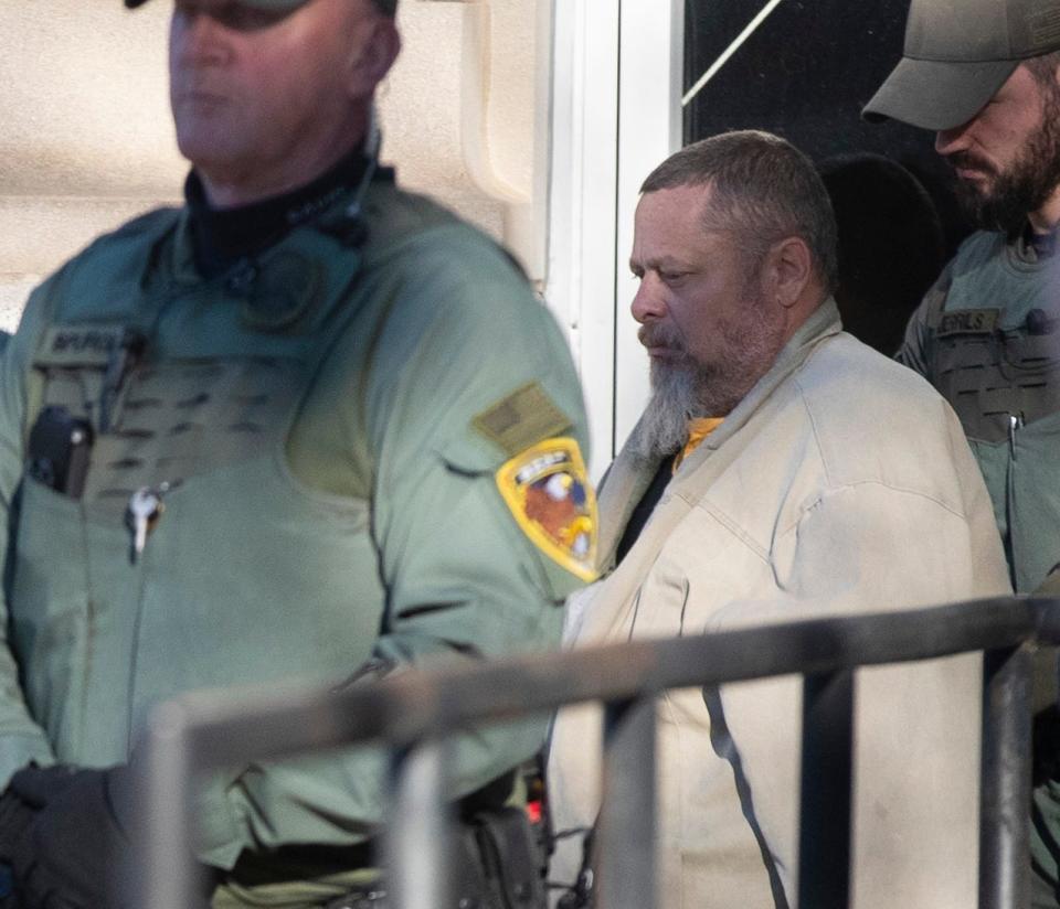 Officers transport murder suspect Richard Allen during a hearing regarding sealed documents, Tuesday, Nov. 22, 2022, at Carroll County Courthouse in Delphi, Ind. 