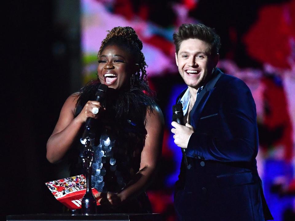 Clara Amfo presenting a Brit Award with pop star Niall Horan (Gareth Cattermole/Getty Images)