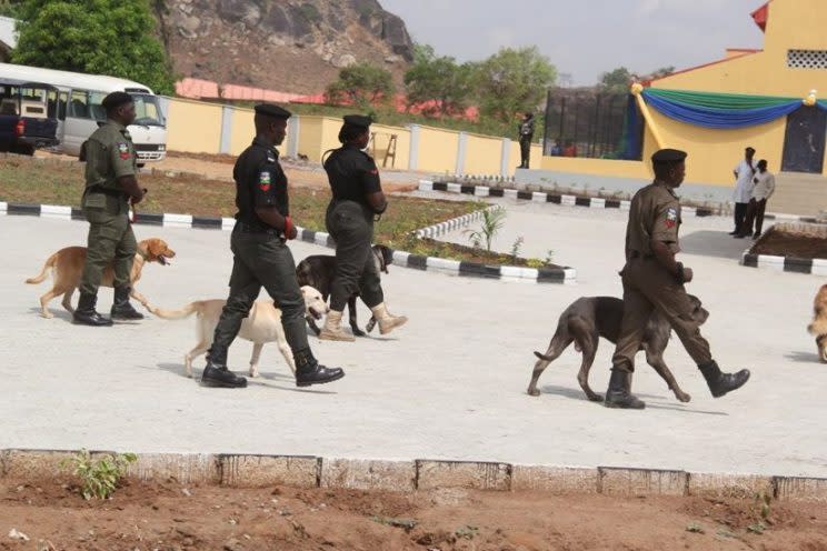 Nigerian soldiers, with sniffer dogs, have been fighting Boko Haram for more than seven years