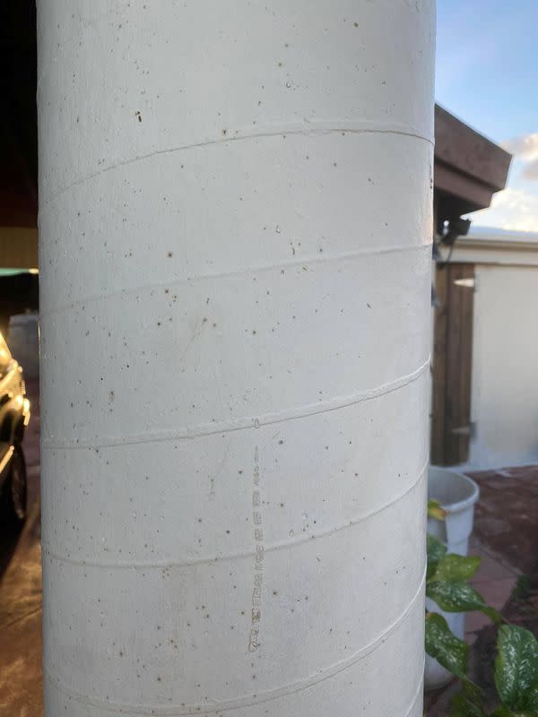 Specks of an oily substance cover a house in St. Croix