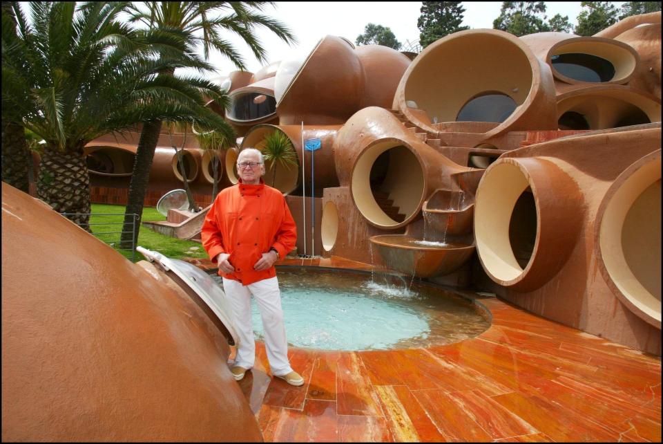 Pierre Cardin standing outside of Palais Bulles in 2003.