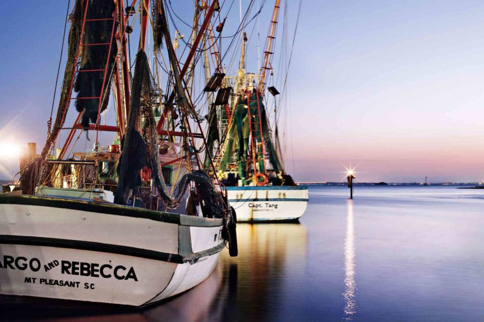 Squire Fox Overlook shrimp boats on Shem Creek as you dine at The Wreck of the Richard & Charlene, in Mount Pleasant.